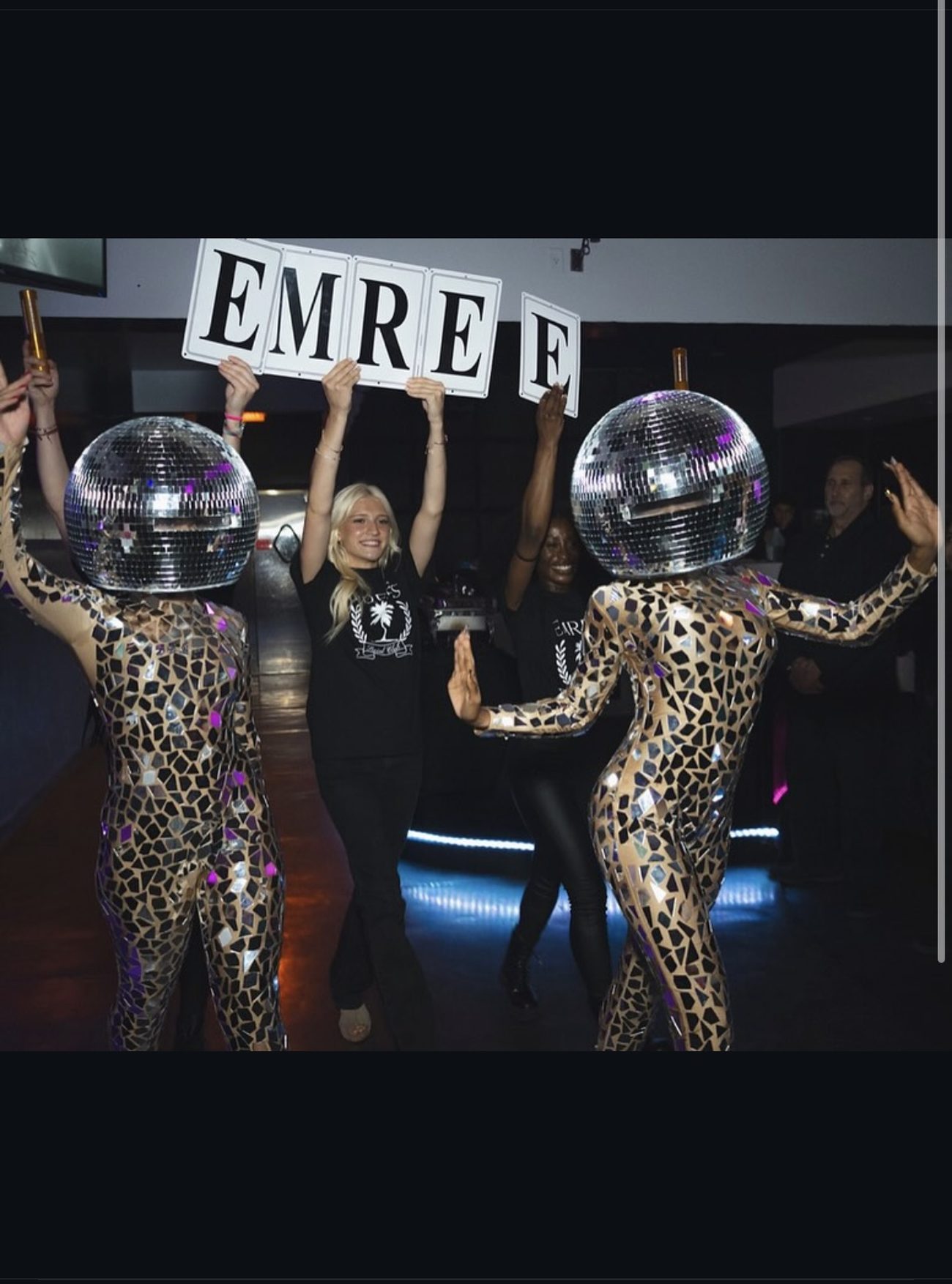 Disco-ball dancers lead a grand entrance with lettered name signs